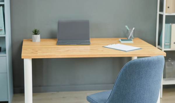 Illustrative photograph of a nurse consultation office with a desk and blue chair
