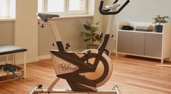 Illustrative photograph of a stationary exercise bike in a rehabilitation studio