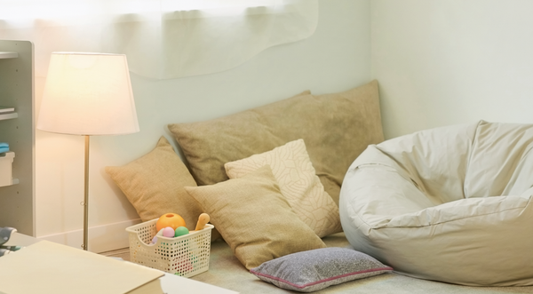 Illustrative photograph of a calming room with sensory-regulation materials