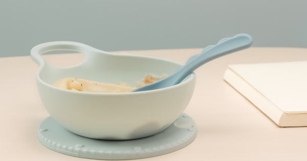 Illustrative photograph of a child-sized bowl and adaptive spoon for a feeding discussion