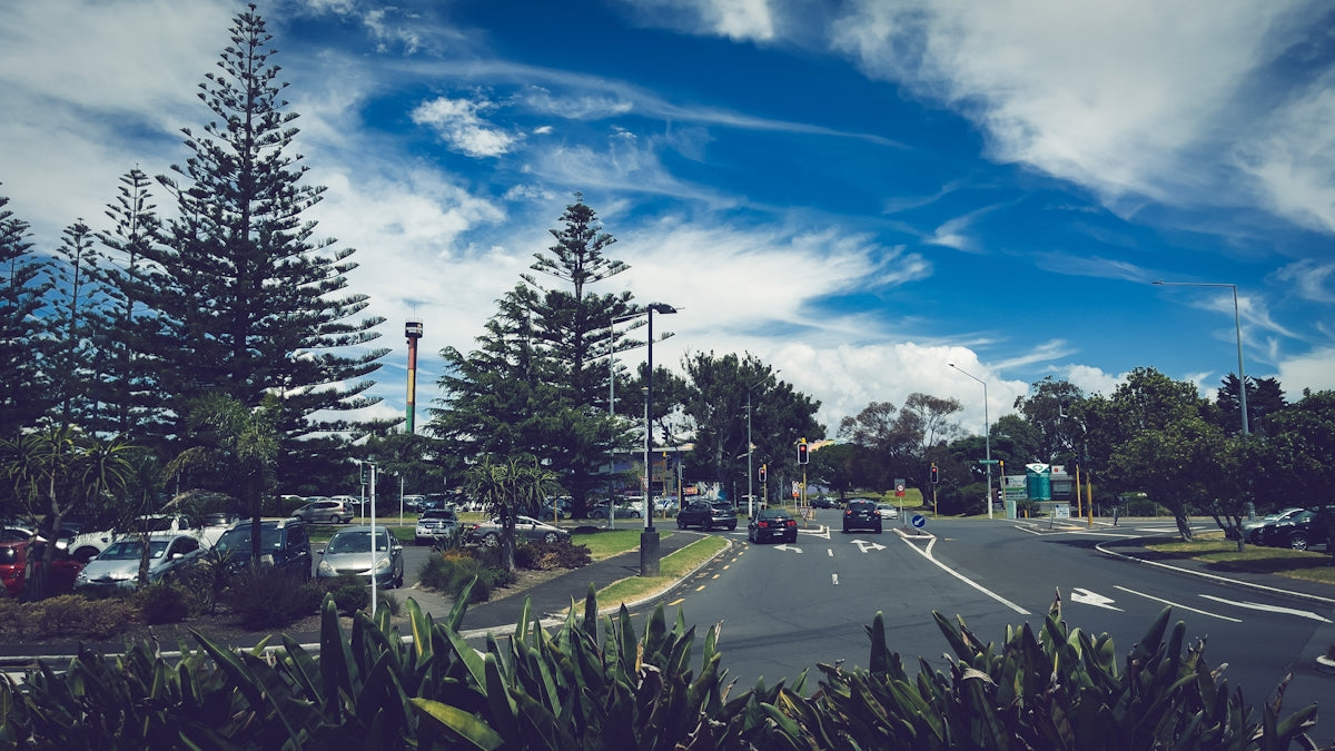 a street with cars parked on the side of the road