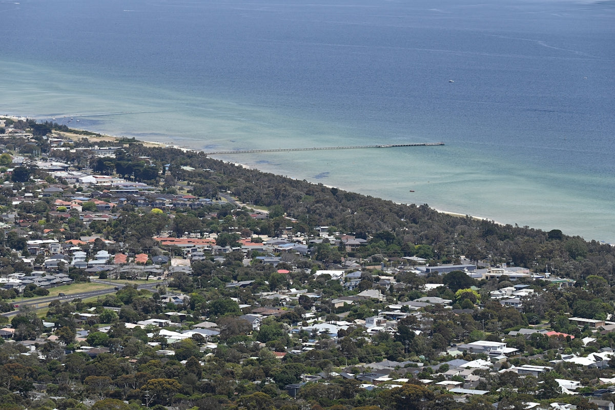 a bird's eye view of a city by the ocean