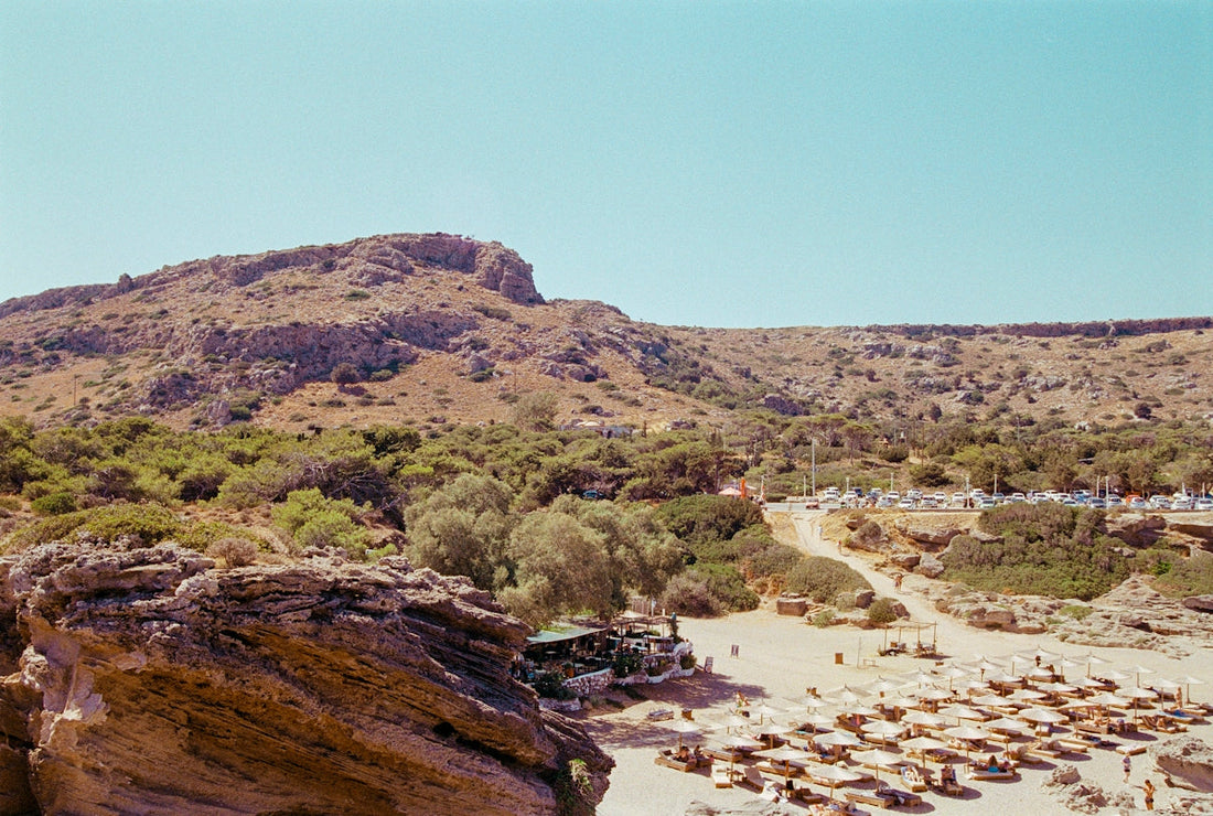A view of a beach with a mountain in the background