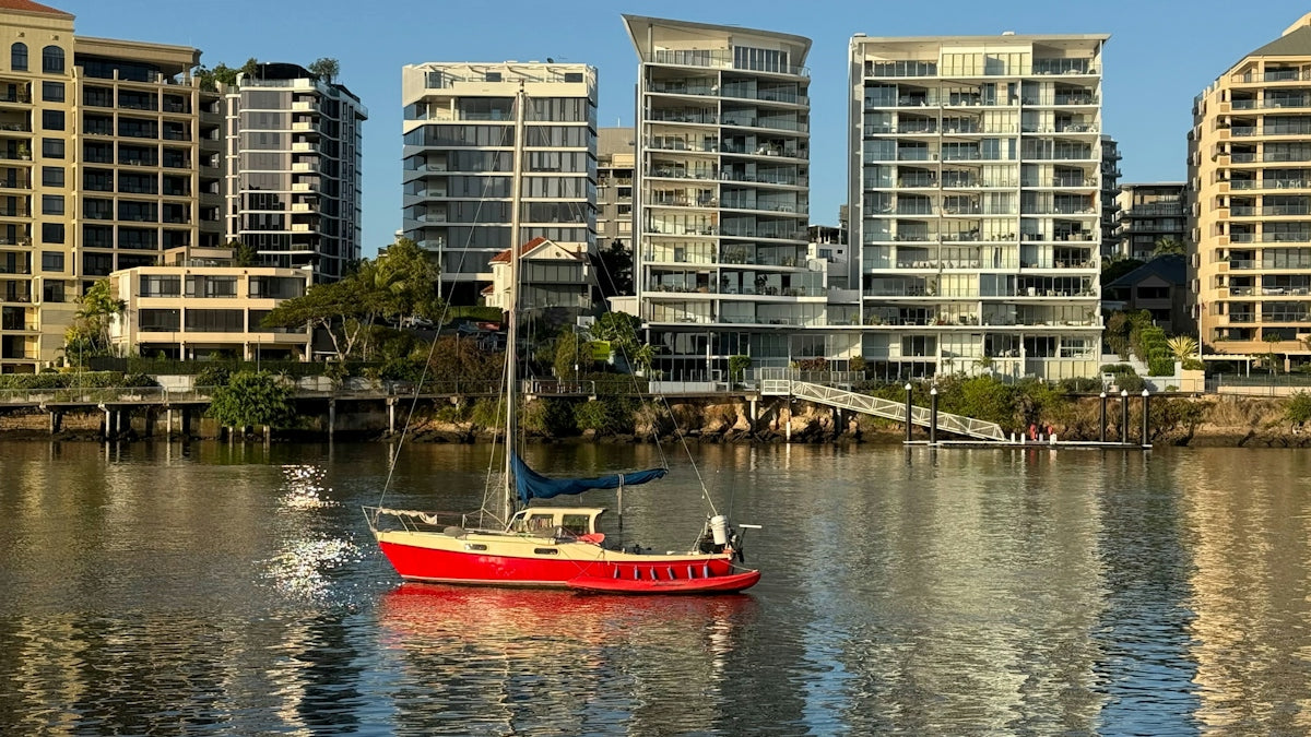 A red boat in a body of water