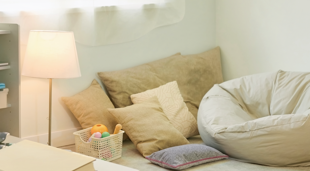 Illustrative photograph of a calming room with sensory-regulation materials