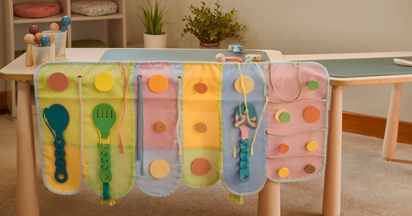 Illustrative photograph of practical dressing and fine-motor learning tools