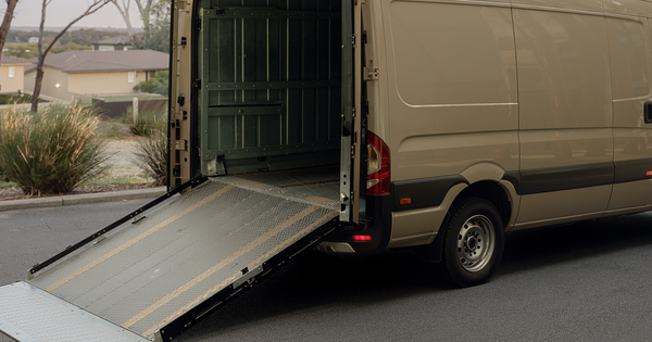 A parked accessible van with a ramp