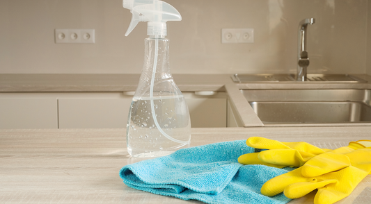 Domestic cleaning supplies on a kitchen bench