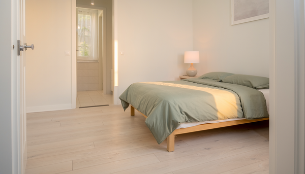 Illustrative photograph of a short-stay bedroom with clear circulation space