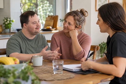 Participant, family member and support coordinator discussing NDIS support choices