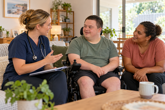 Registered nurse discussing disability-related health support with an NDIS participant and support worker