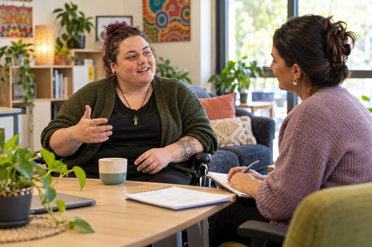 NDIS participant speaking with a psychosocial recovery coach during a strengths-based planning conversation