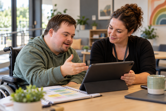 NDIS participant and support coordinator reviewing progress and goals for a plan reassessment