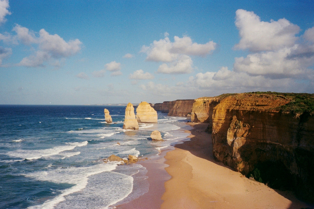 brown rock formation on sea shore during daytime