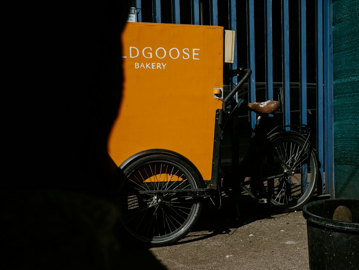 man in black jacket riding bicycle