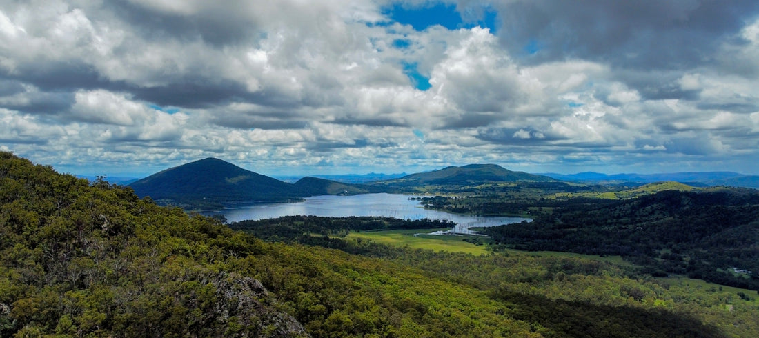 a scenic view of a lake surrounded by mountains