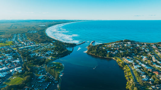 an aerial view of a city by the ocean