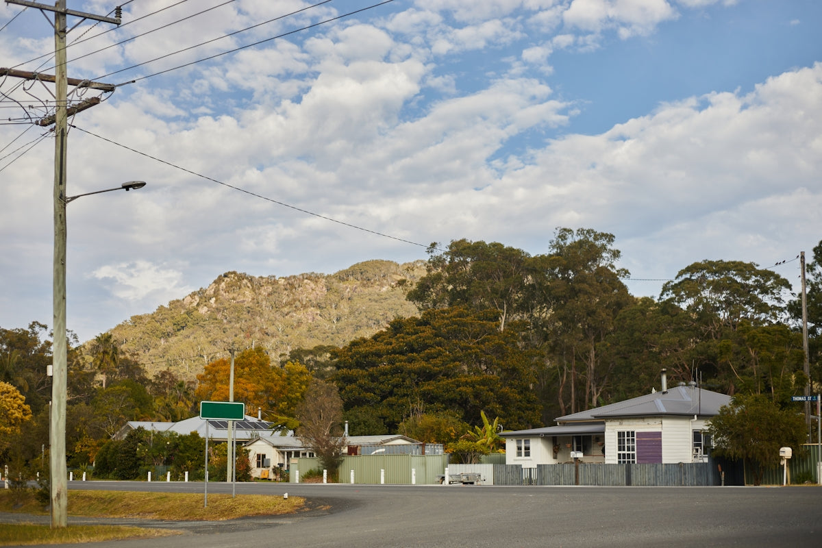 a street with a mountain in the background