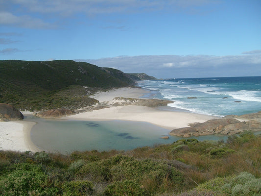 a view of a sandy beach and a body of water