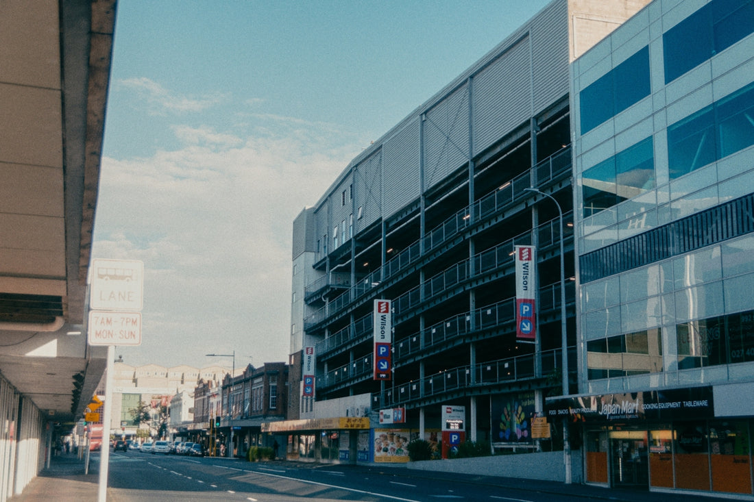 a city street lined with tall buildings on both sides of the street