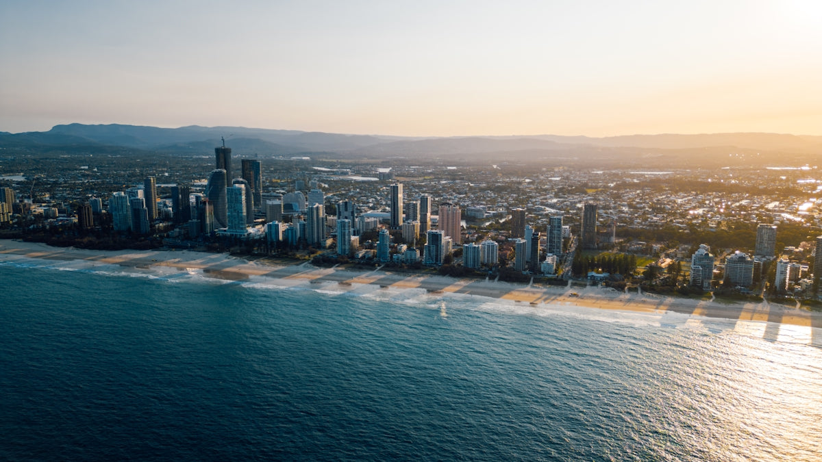 An aerial view of a city next to the ocean