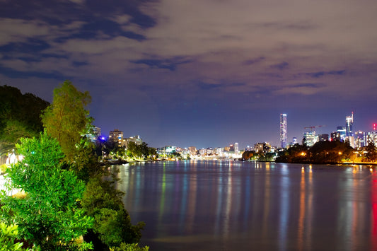 A view of a city at night from across the water