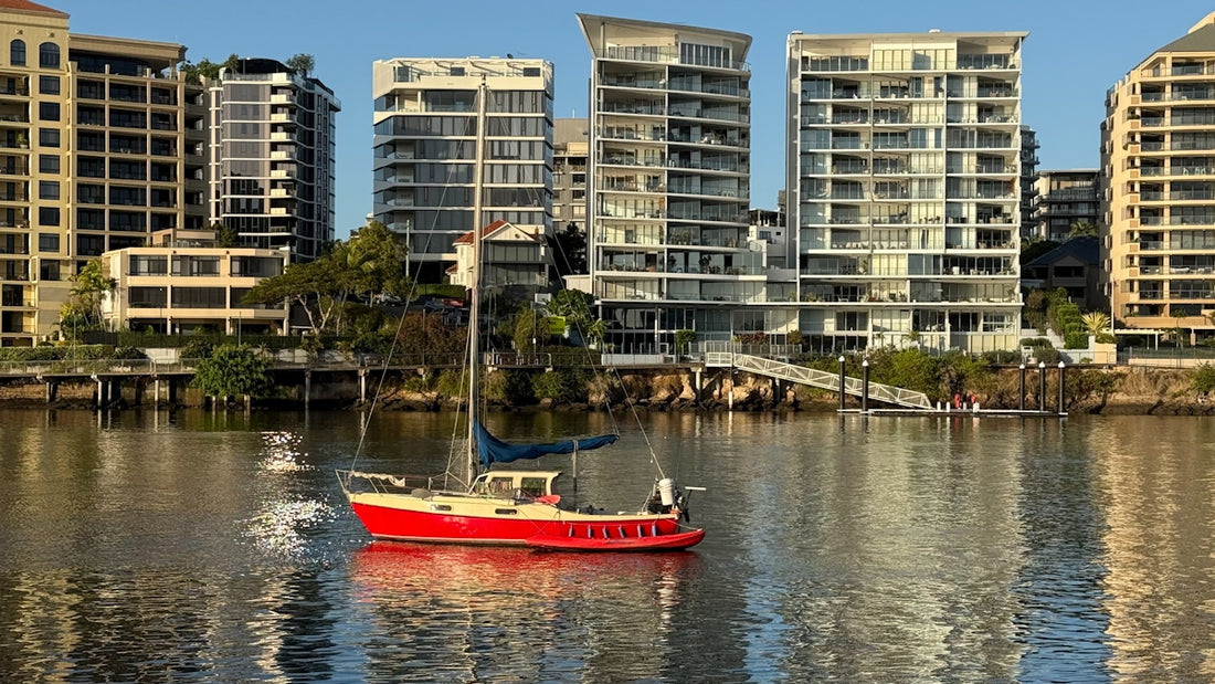 A red boat in a body of water