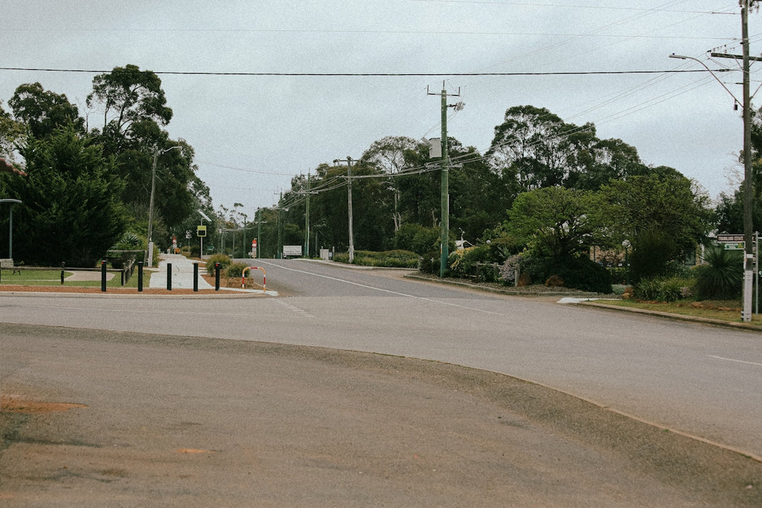 A stop sign on the corner of a street