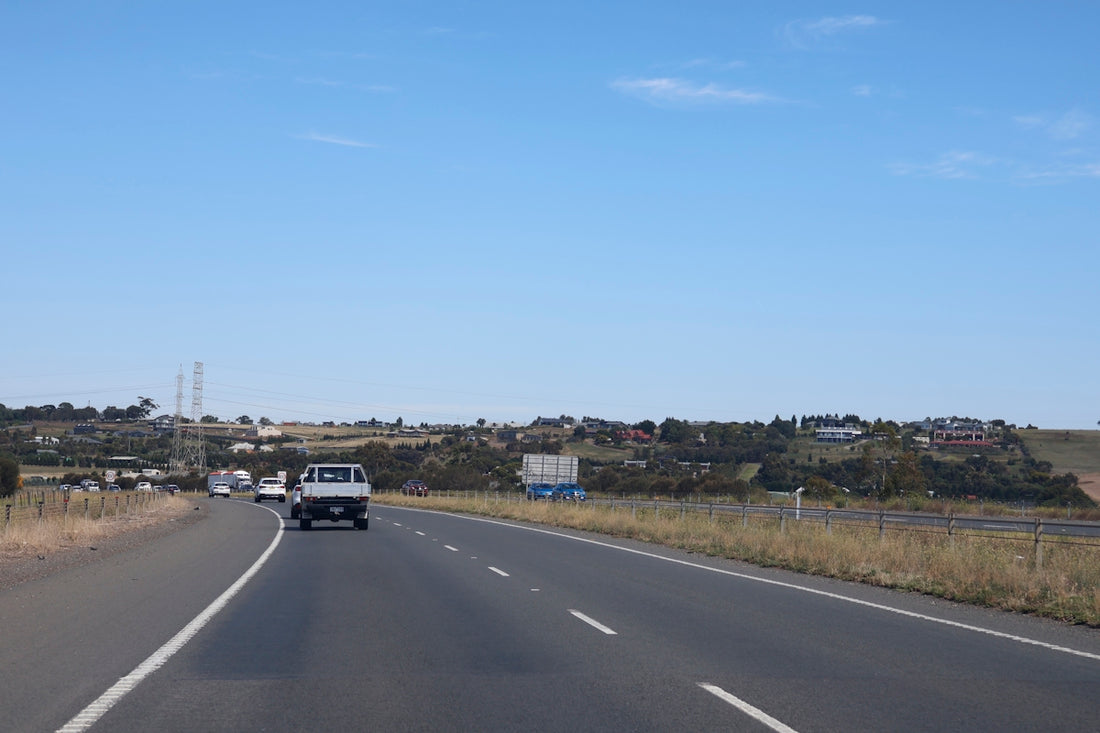 A road leads towards a small town.