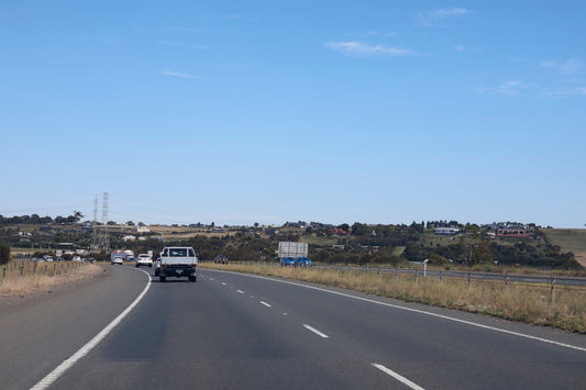 A road leads towards a small town.