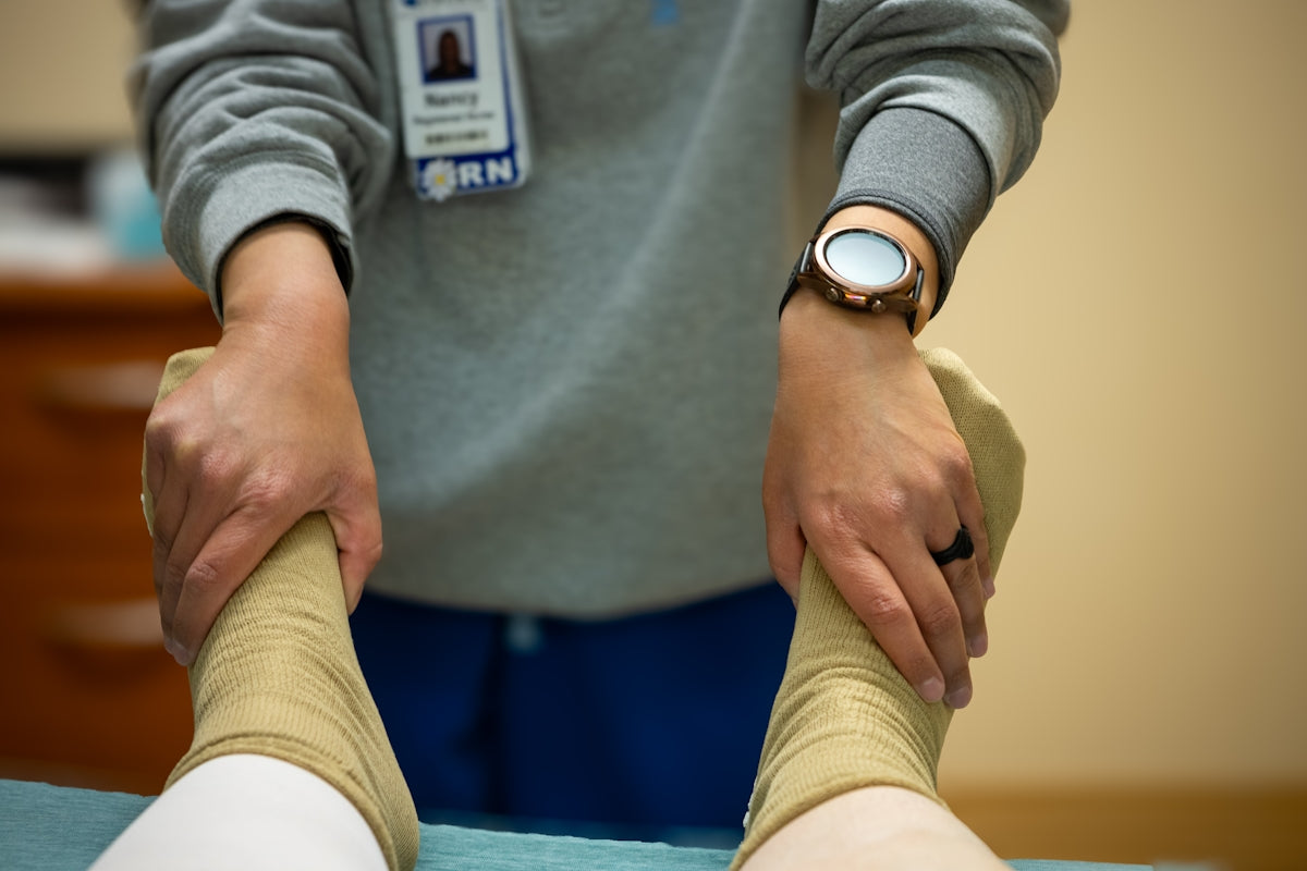 A nurse is performing physical therapy.