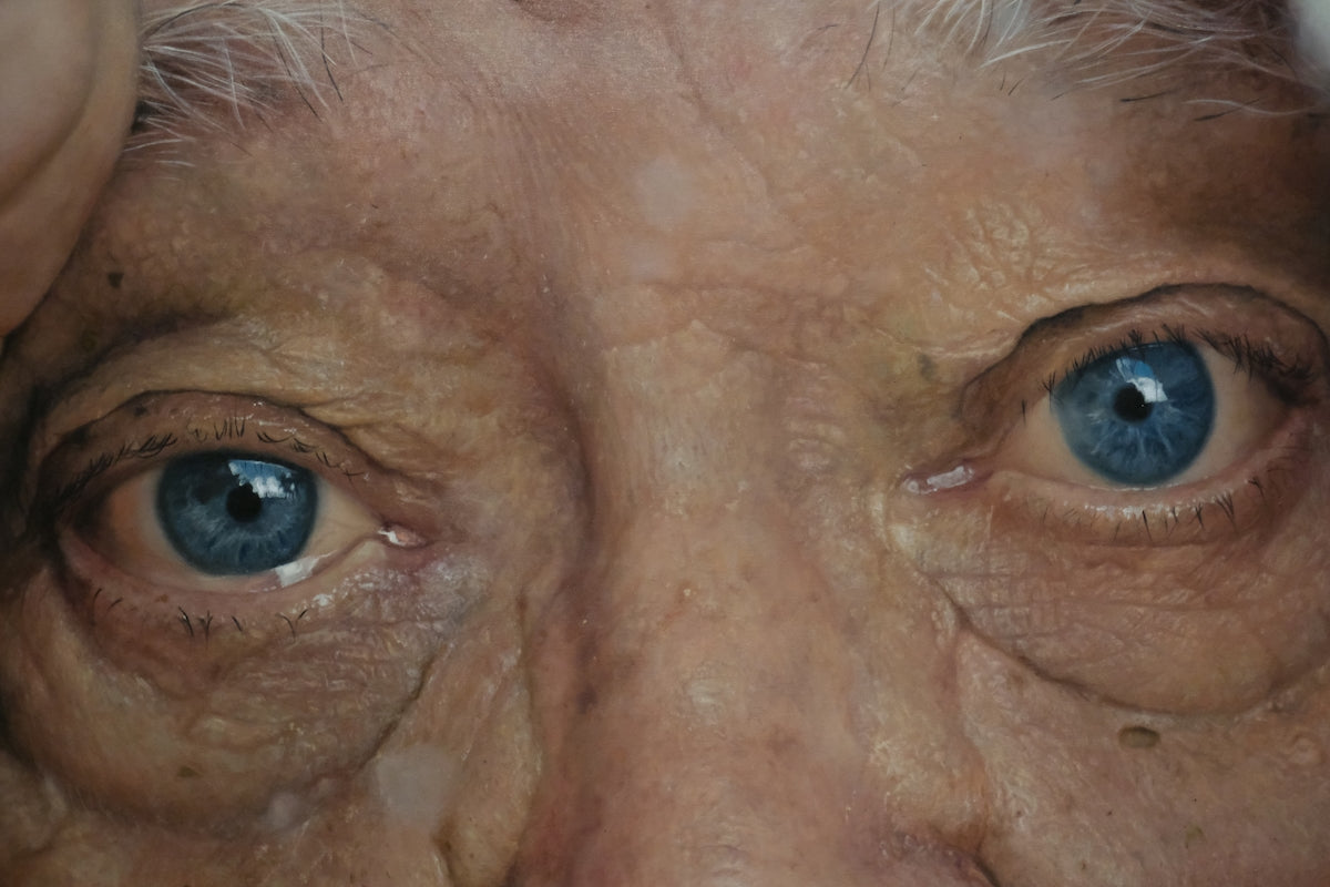 Close-up of an elderly person's blue eyes.