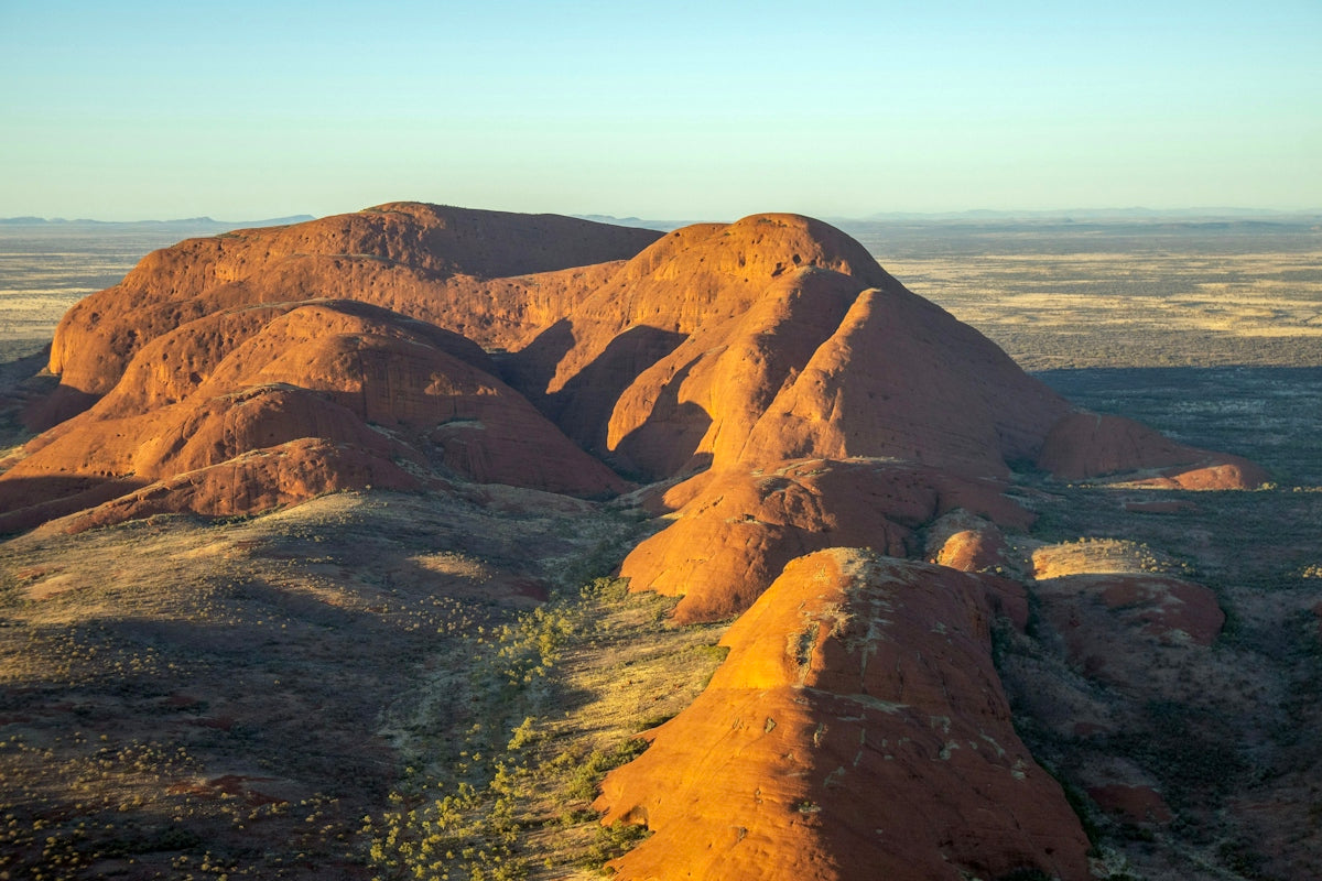Massive sandstone rock formation in a desert landscape