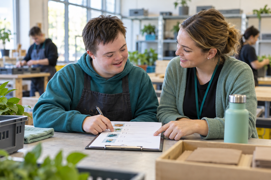 Young NDIS participant discussing a work skills checklist with an employment coach in a community workshop